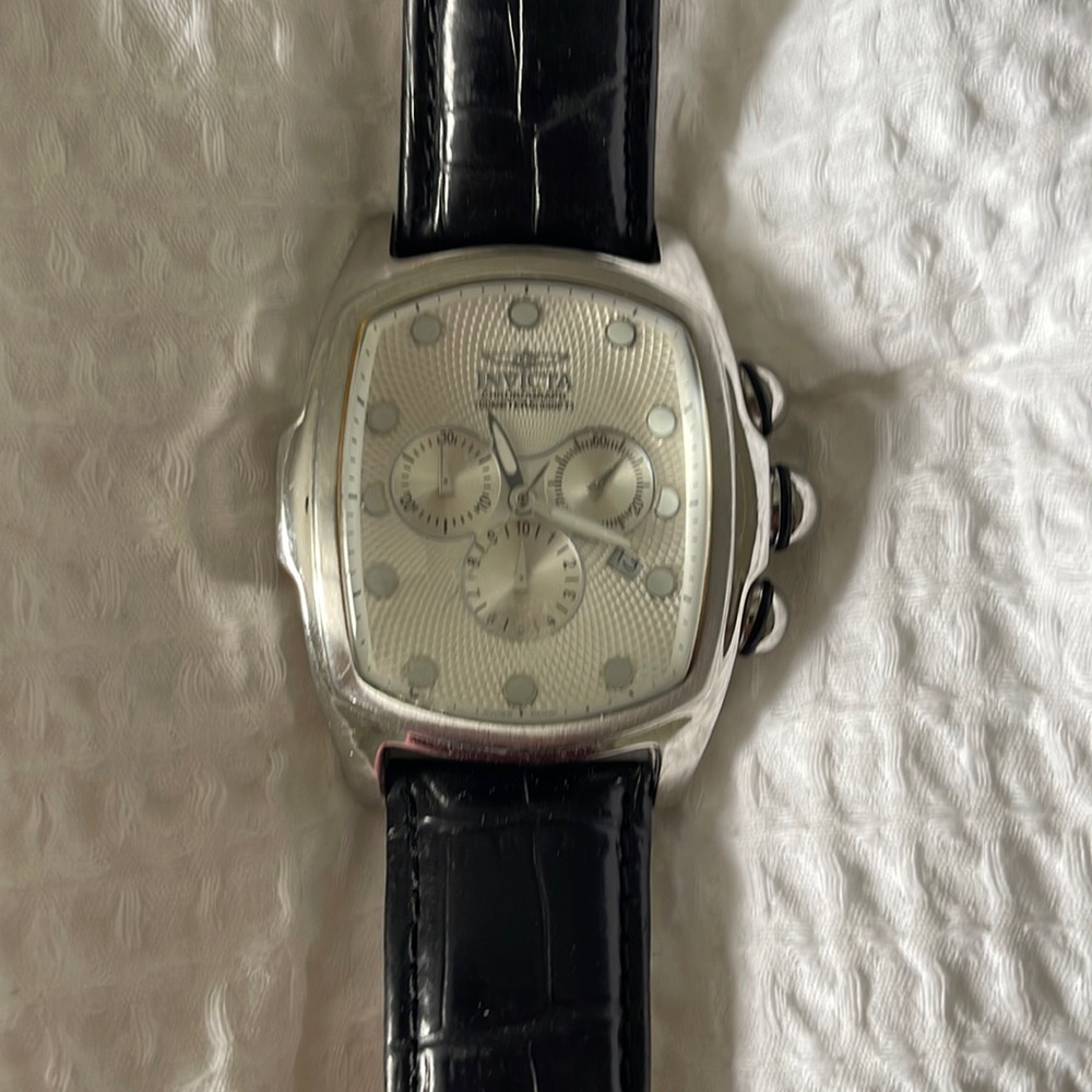 I am selling an Invicta 6401 Lupah Chronograph Watch with a black leather band.